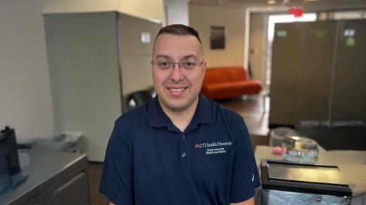 An image of Spencer Chichester in a work cubicle.