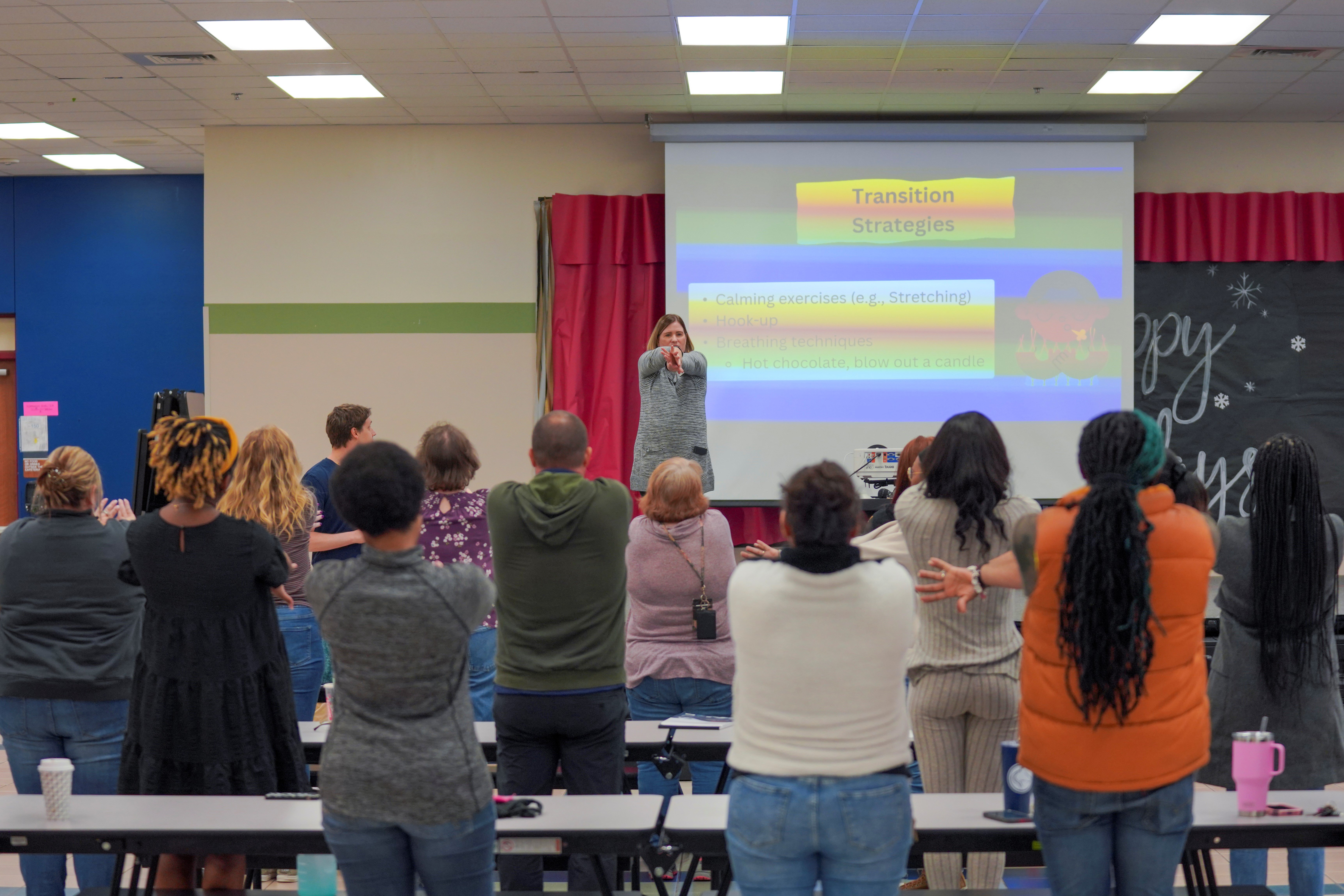 A MAGIC district partner leading a training session in a school.