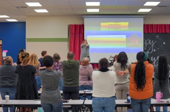A MAGIC district partner leading a training session in a school.