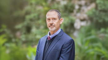 Portrait image of Andrew Springer outside in nature.