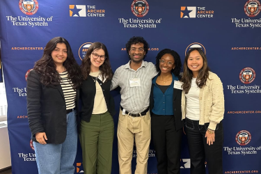 Archer fellows pictured in front of backdrop.