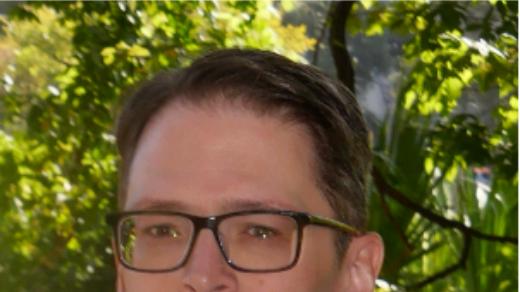 Benzer in front of bushes