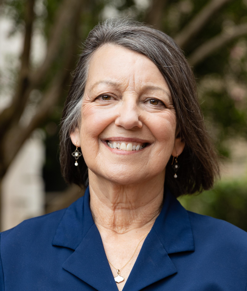Catherine Troisis smiling wearing blue shirt