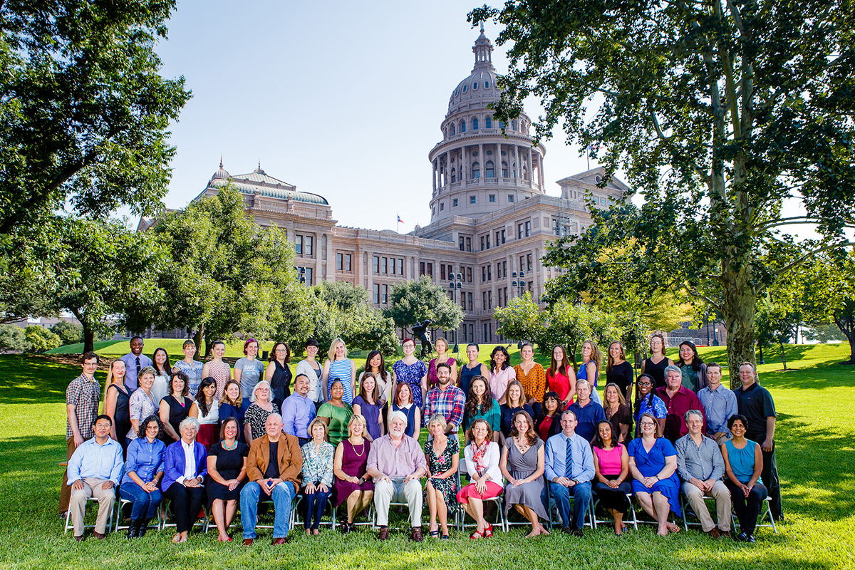 Group of Austin Faculty photographed in front of the Austin Capitol Building